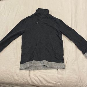 Gray jumper, in size large for children, but fits a size small adult.